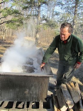 John checking the fire