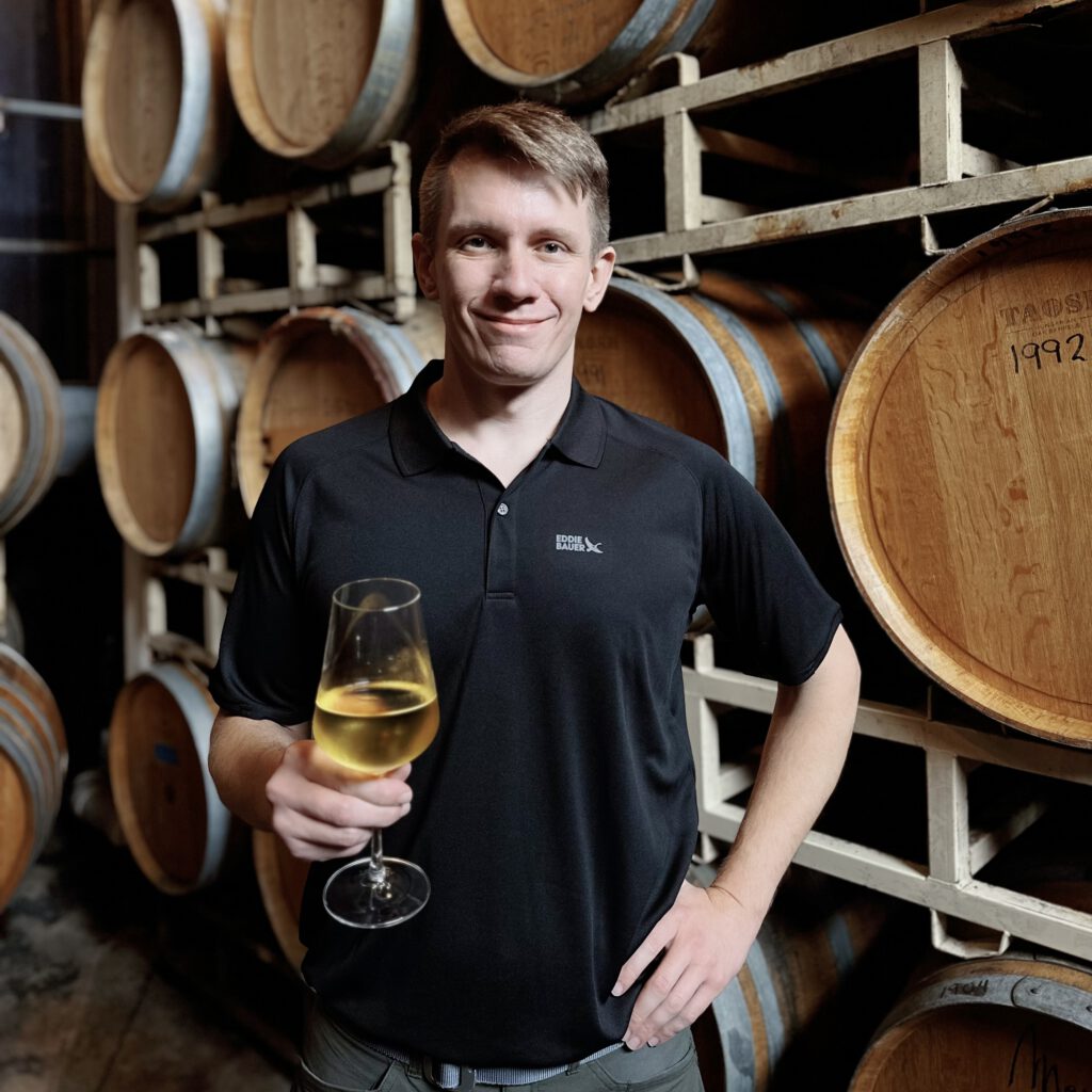 Associate Winemaker Rick holding a glass of wine