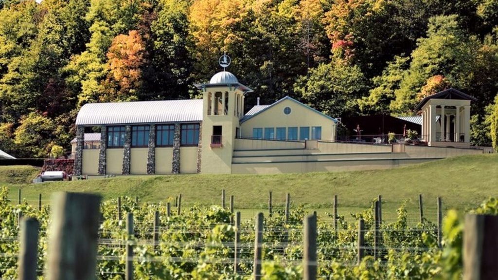 Fall photo of Heron Hill Winery building and vineyards